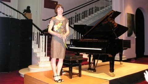 Tetyana taking a bow beside the grand piano after her National Concert Hall recital