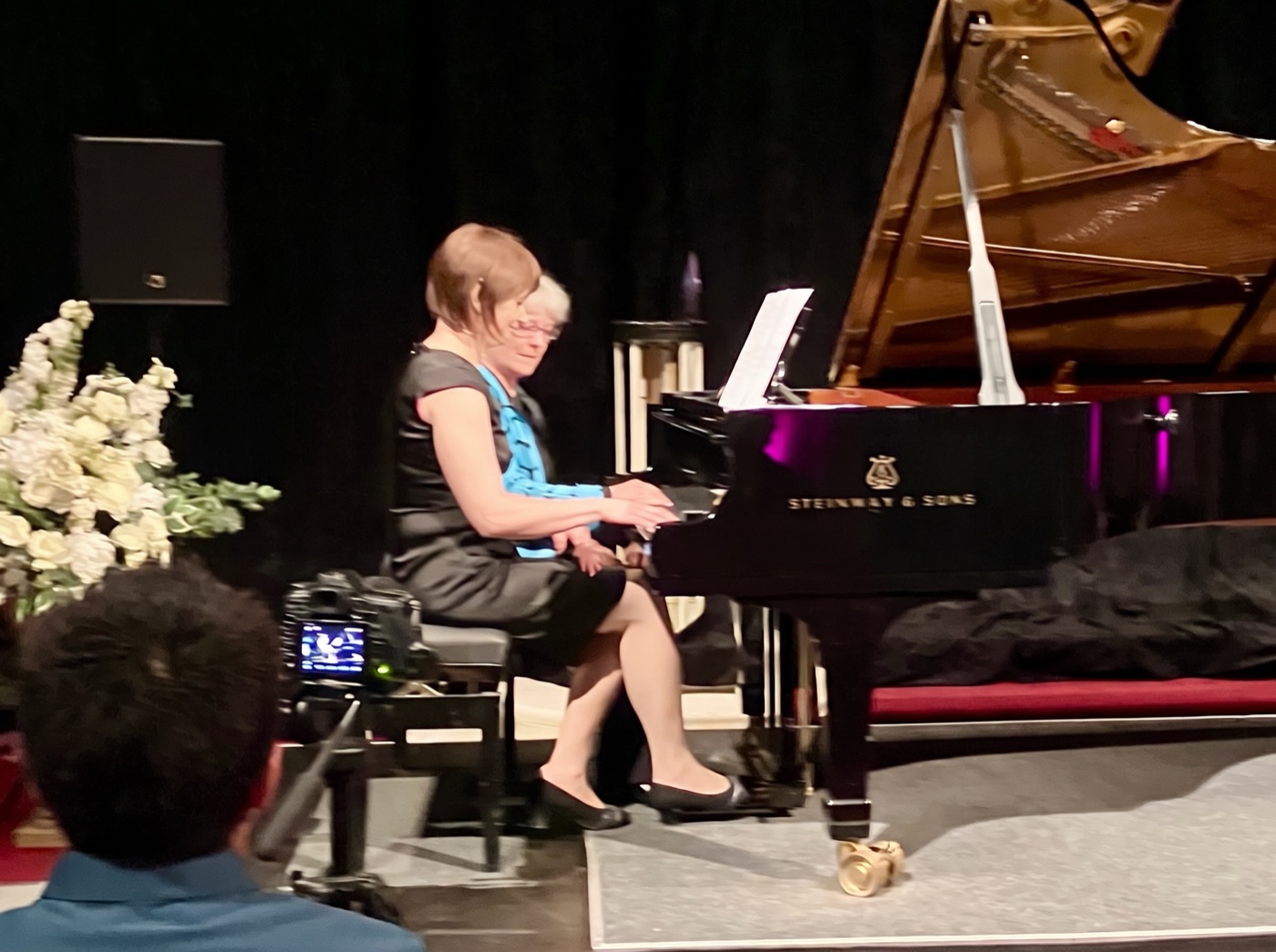 Tetyana performing on a Steinway grand at a recital